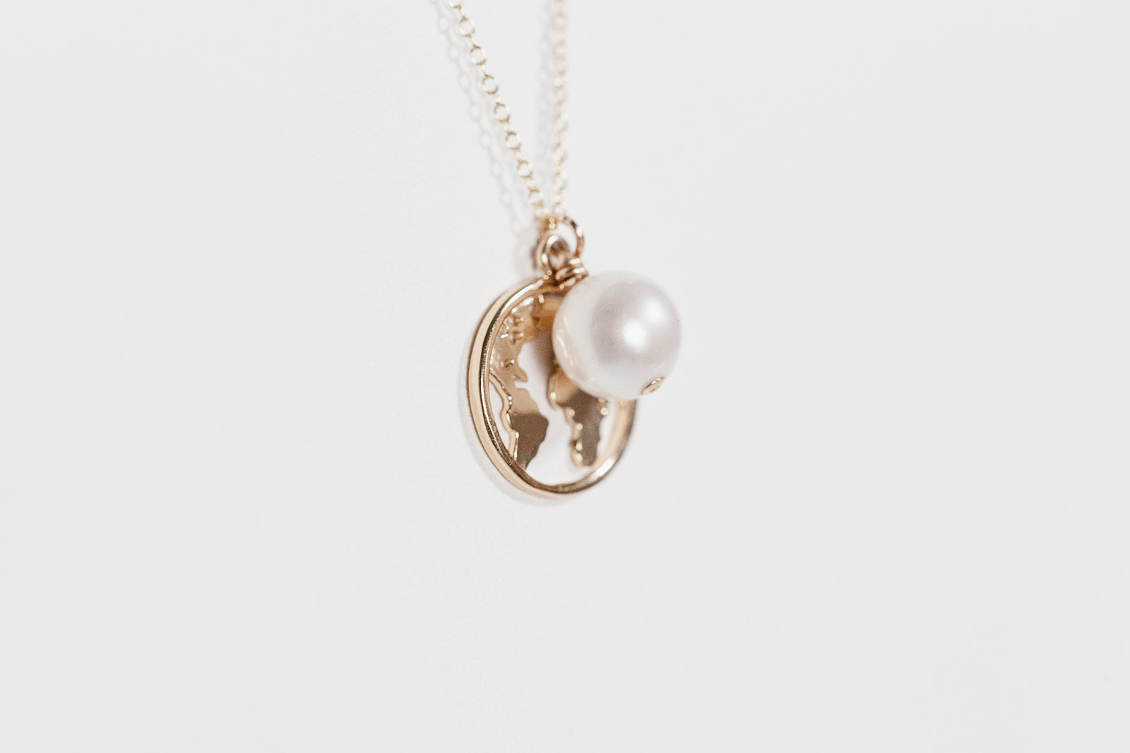 Pearl Drop Necklace with World Charm